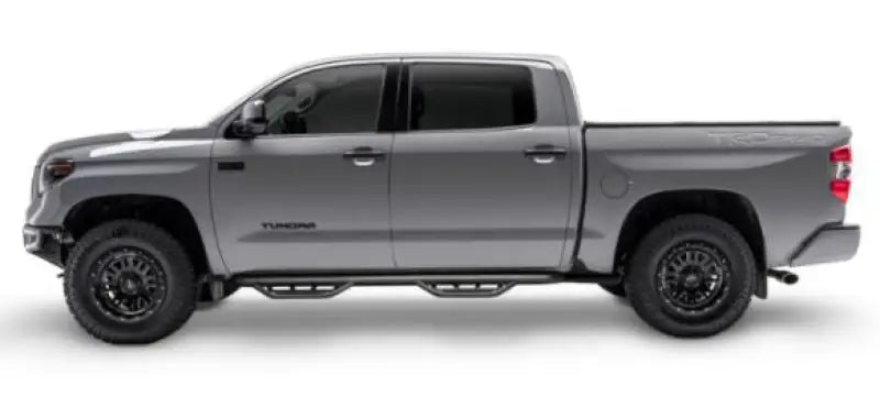 Gray Toyota Tundra with matte black stainless steel nerf bar and drop down steps