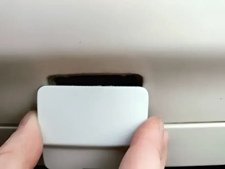 White rectangular cover being removed from ProTaper aluminum shifter for KTM Husqvarna