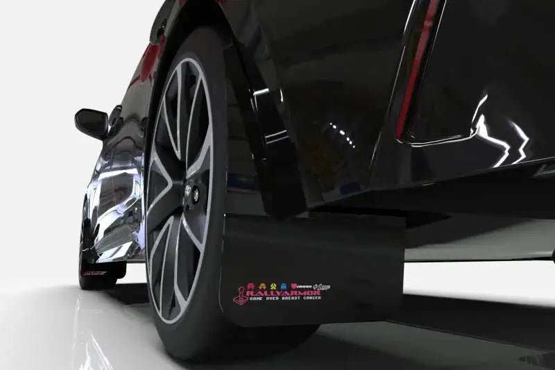 Black mud flaps on Ford Focus rally armor style for a sleek look