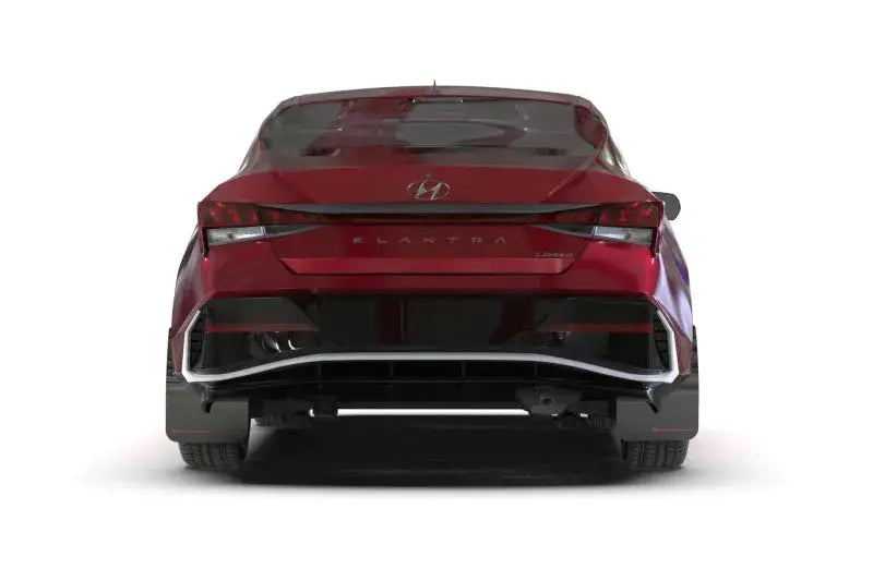 Rear view of a red Hyundai Elantra with black mud flap and white logo in Rally Armor 2024