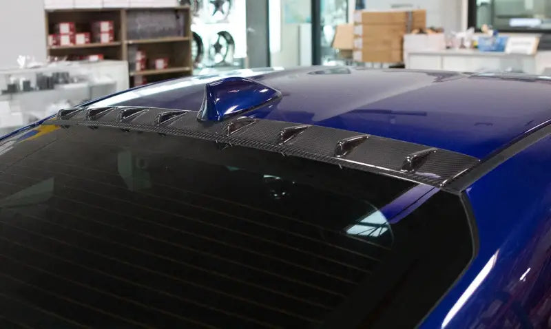 Blue car with vortex generator and rear window louvers on Revel GT Carbon Toyota GR86