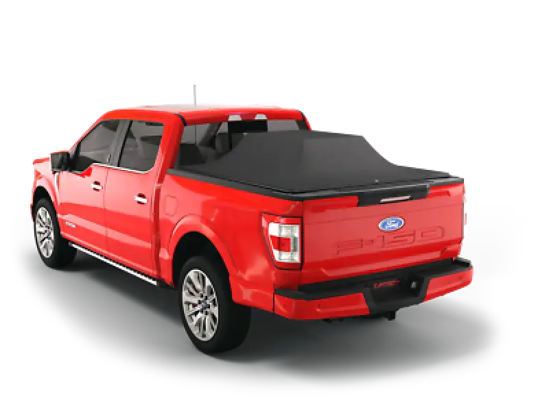 Red Ford F-150 pickup truck with tonneau cover.