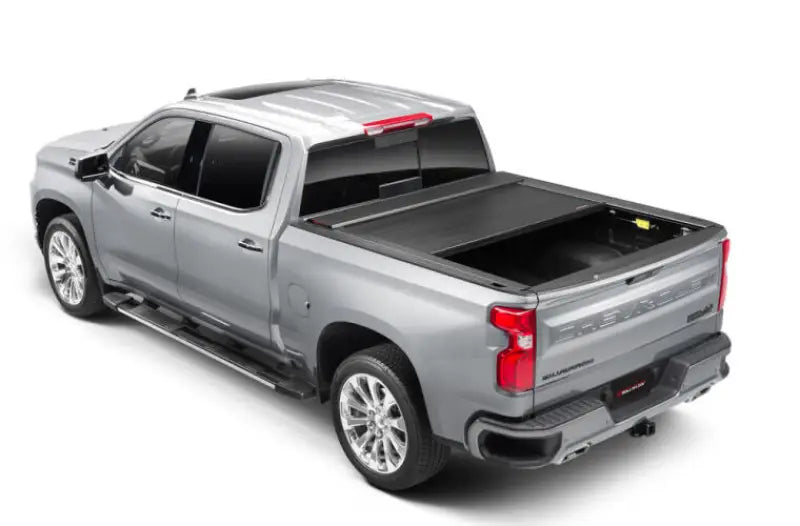 Silver pickup truck with matte black tonneau cover power retractable and lockable