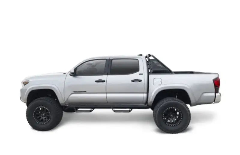 Silver lifted pickup truck with textured powder coat tubular bar and 30 inch light bar