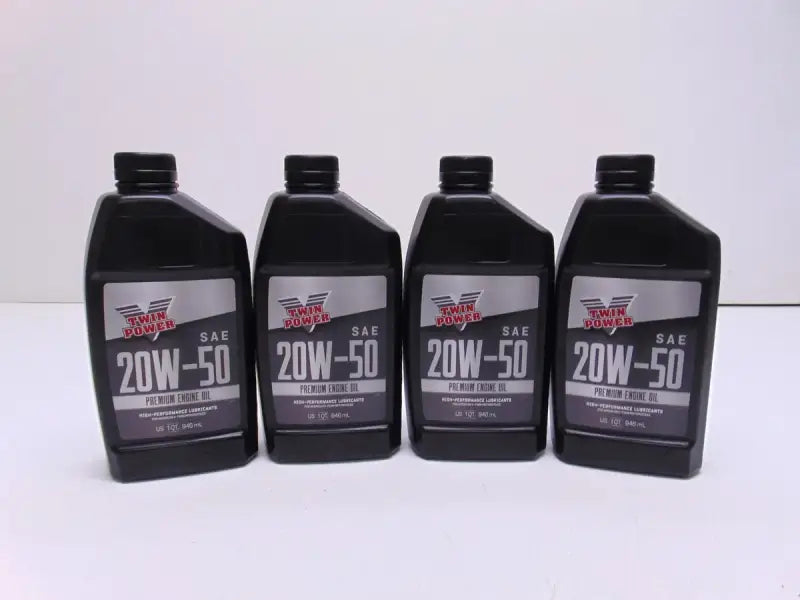 Four bottles of Twin Power 20W50 Synthetic Oil Quart for engine performance