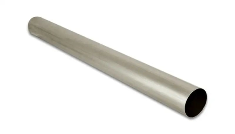 A horizontal, cylindrical metal pipe with a reflective, smooth surface. This Vibrant 3in O.D. Titanium Straight Tube 1 Meter Long is made from CP1 grade titanium and open at one end, displaying its hollow interior as it extends into the background, gradually fading from view. The background is plain and white—a perfect piece for automotive enthusiasts.