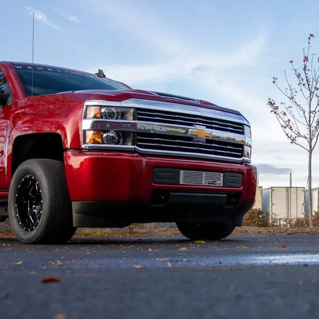 Red Chevrolet Silverado pickup truck with Wehrli LML L5P Duramax bumper grille