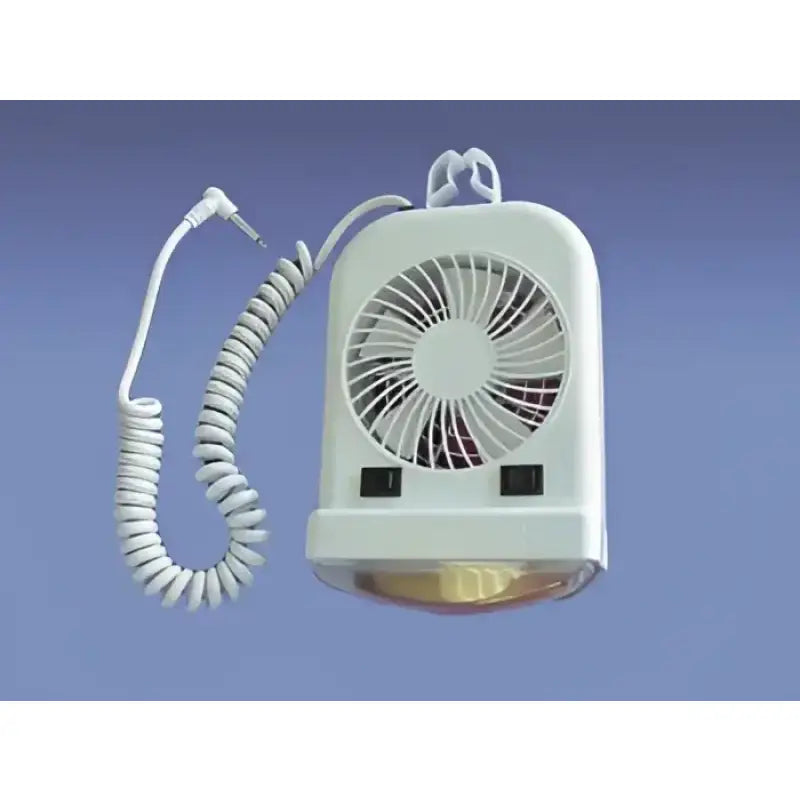 a white fan sitting on top of a table