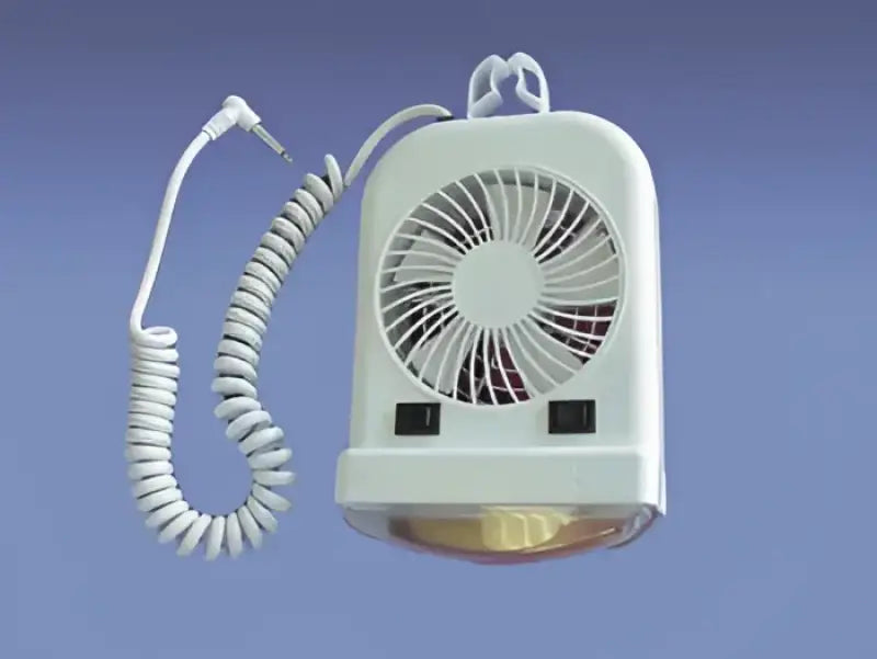a white fan sitting on top of a table