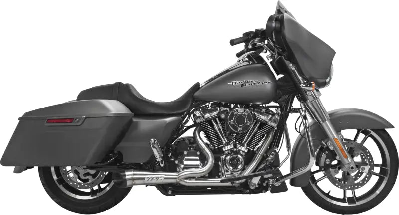 005-4870199 Comp S 2in1 Exhaust Touring M8 Brushed W/Turnout installed on a Harley Davidson motorcycle, featuring race-inspired stainless steel headers and heat shields for maximum torque.