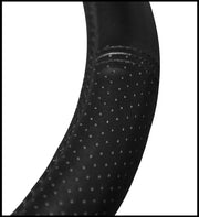 Close-up of 006697R25 Plasticolor Ram Deluxe Steering Wheel Cover showcasing high-quality material and textured grip.