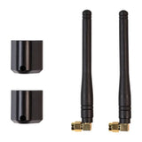 Two black Garmin Ondeck LTE antennas with gold connectors and mounts for replacement