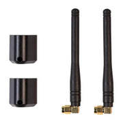 Two black Garmin Ondeck LTE antennas with gold connectors and mounts for replacement