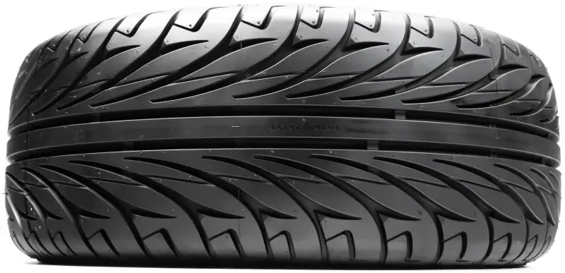 Black car tire with aggressive tread pattern from 042015001a1 Kenda Kanine