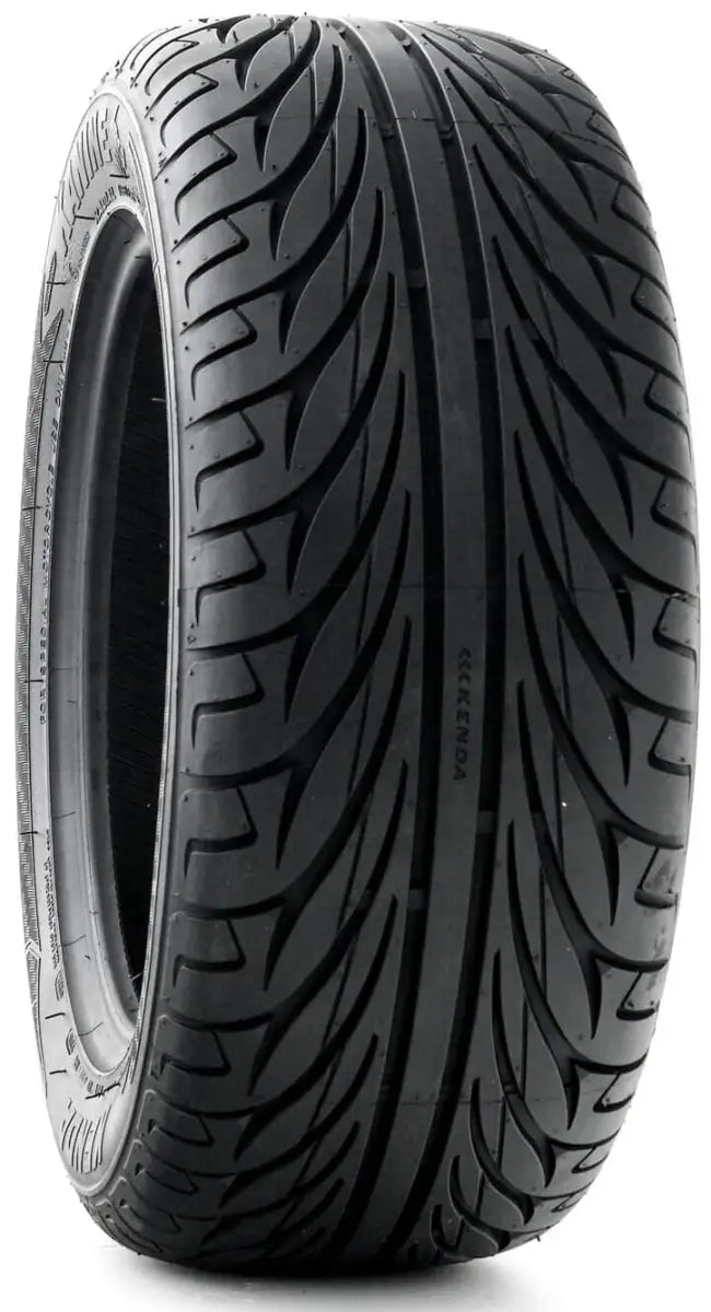 Black car tire with directional tread from 042015001a1 Kenda Kanine model