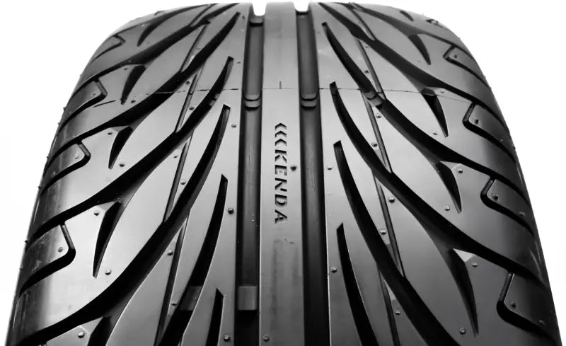 Close-up of black tire tread with directional pattern for 042015002A1 Kenda Kanine can-am spyder