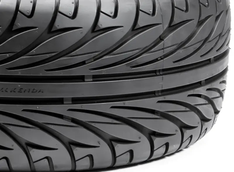 Close-up of 042015002A1 Kenda Kanine tire tread with asymmetrical pattern for Can-Am Spyder