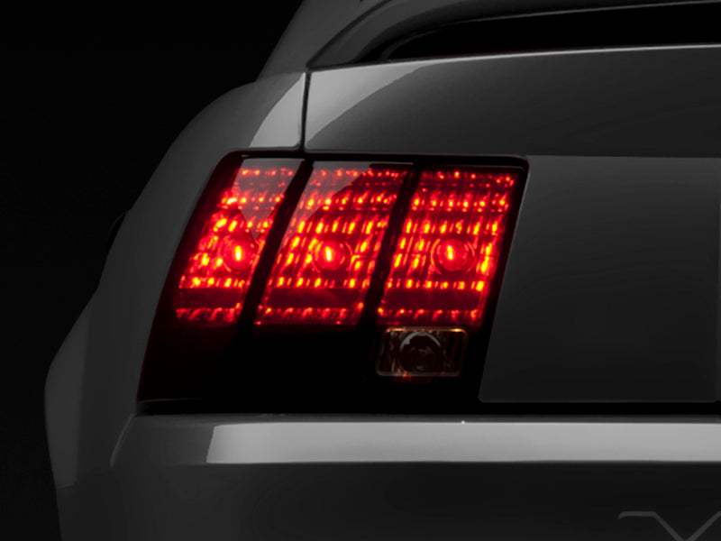 Raxiom 49080 Raxiom 99-04 Ford Mustang Excluding 99-01 Cobra Tail Lights- Black Housing (Smoked Lens)