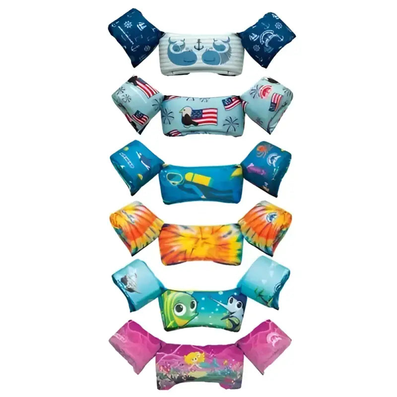 Colorful assortment of Airhead Elite Child Life Vest Scuba, featuring multiple vibrant designs and sturdy construction for water safety and comfort.