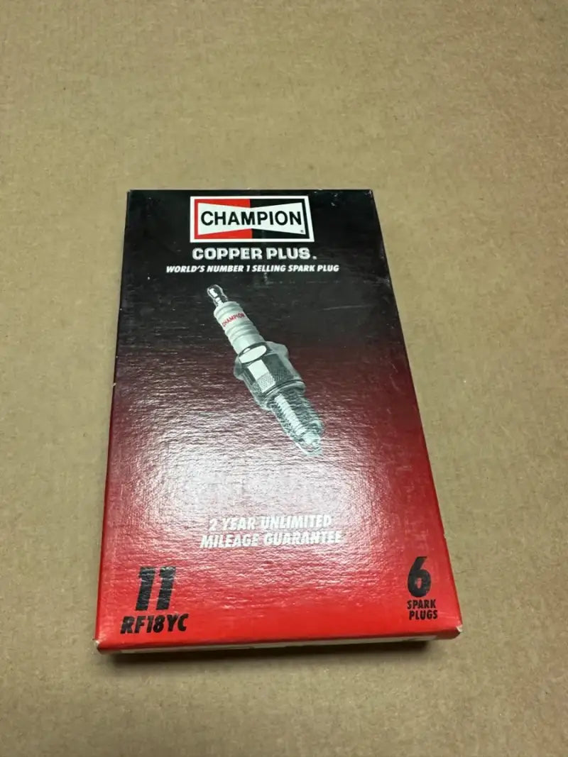Box of 11 Champion Copper Plus Spark Plugs, 6 per box, ensuring reliable engine performance.