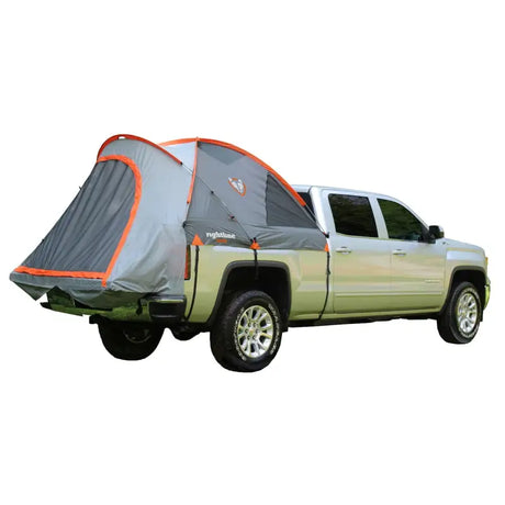 Rightline Gear mid-size short bed tent setup on a green truck, showcasing its weatherproof construction, custom fit, and integrated ventilation.