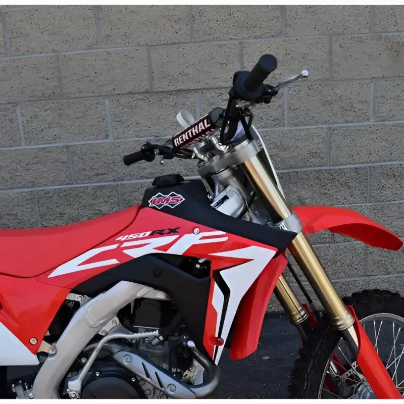 Red and black Honda dirt bike with gold forks and 112249-N2 IMS fuel tank
