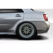 Silver Subaru Impreza WRX with widebody fender flares and custom wheels for Extreme Dim