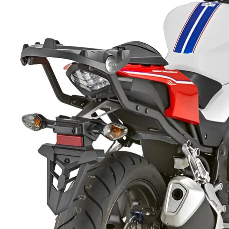 Rear view of white red black motorcycle with matte black luggage mounting hardware