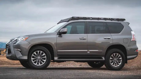 Gray Lexus SUV with roof rack featuring Sherpa Equip for superior aerodynamics and driving experience