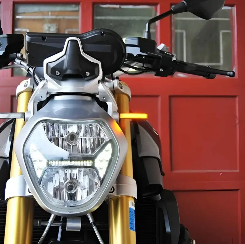 Close-up of 1200R-FS Front Led Turn Signals on motorcycle with gold forks