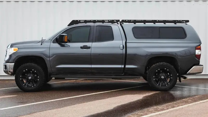 Gray pickup truck with roof rack featuring Sherpa Equip Bear Half Fairing for added style