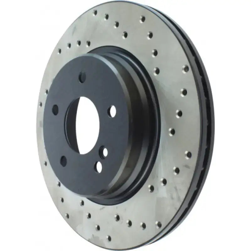 Black Stop Tech rotor with drilled holes and grooves for GM 97-02