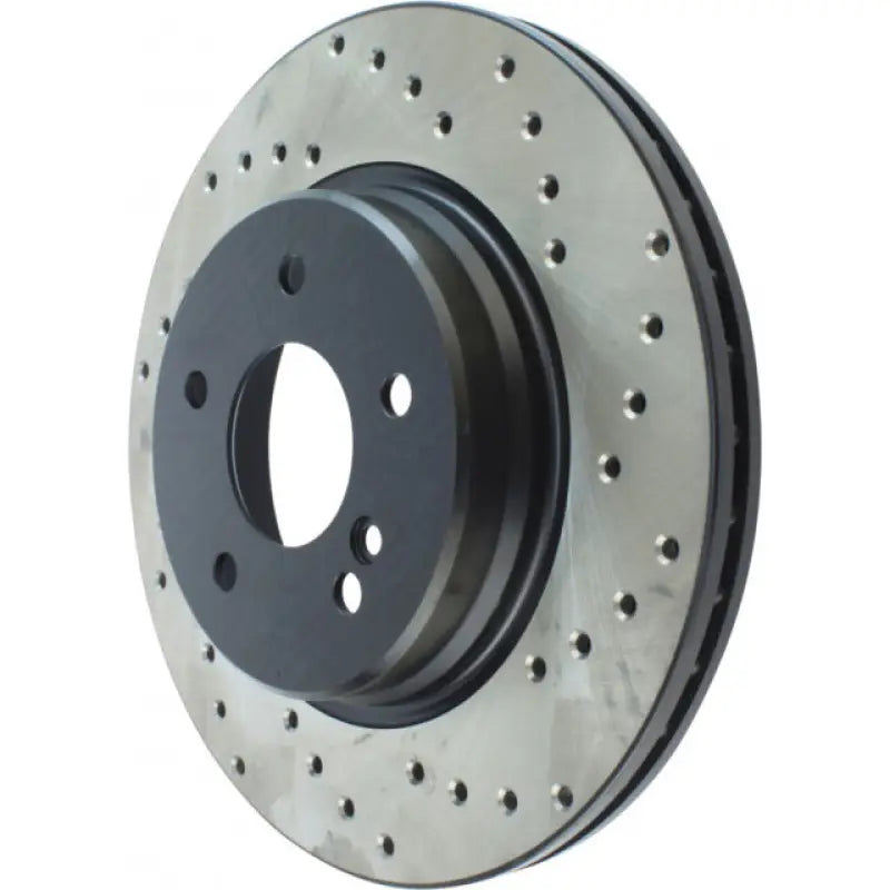 Black Stop Tech rotor with drilled holes and grooves for GM 97-02