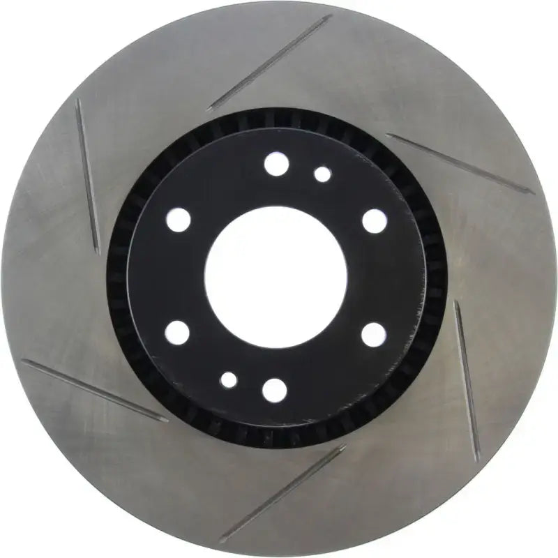 Silver Stop Tech slotted brake rotor with grooves and holes, right side