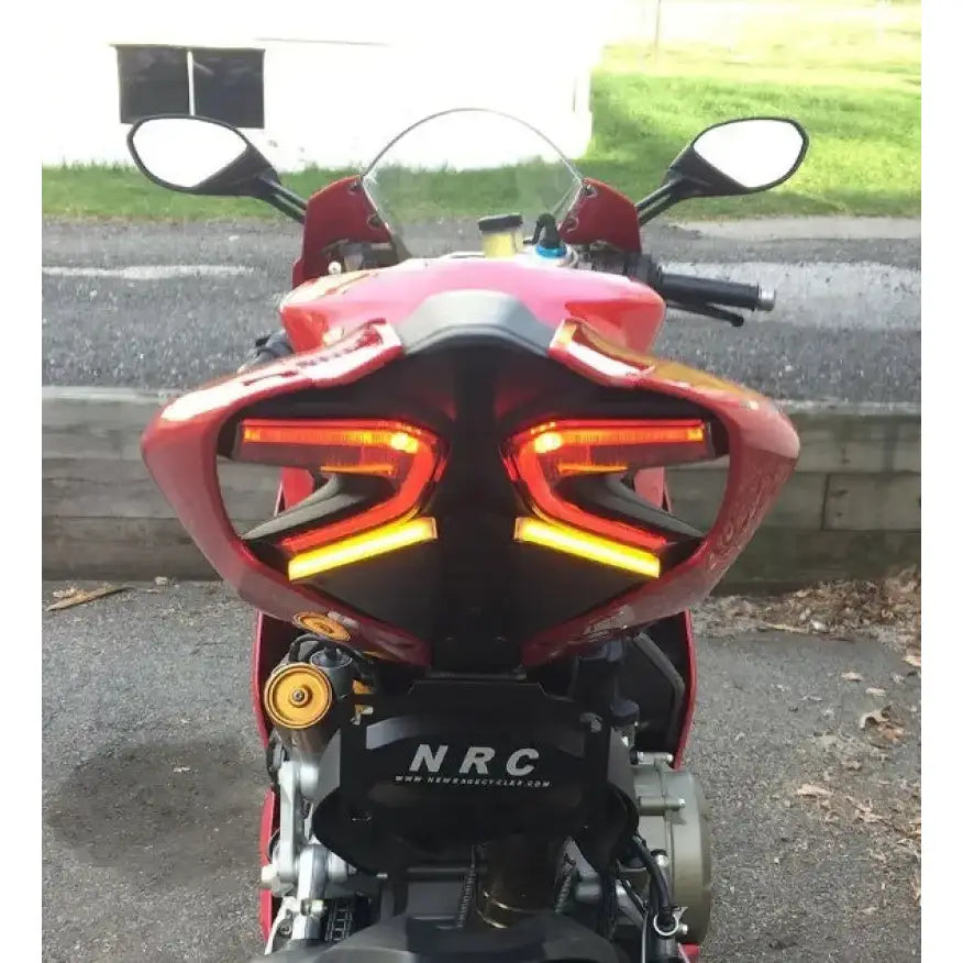 Red sport motorcycle with glowing LED taillights and 1299-FE Fender Eliminator Duc