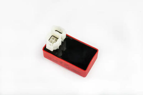 Red and black CDI box with white connectors, perfect for RV parts & accessories