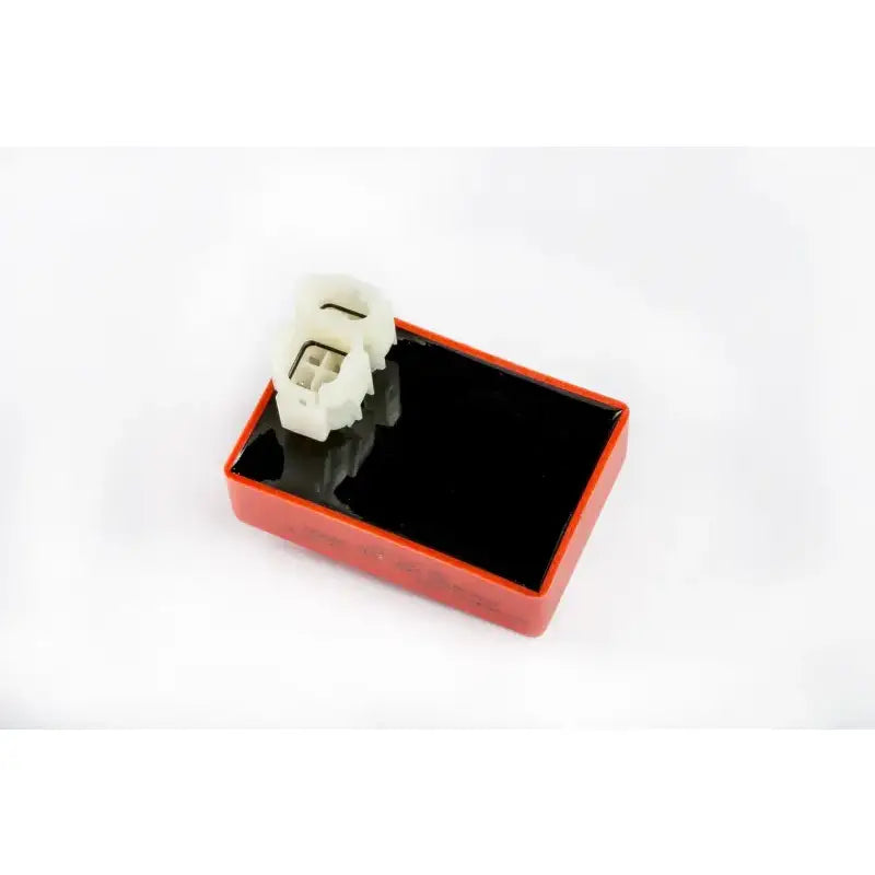 Red and black CDI box with white connectors for Powersports RV parts & accessories