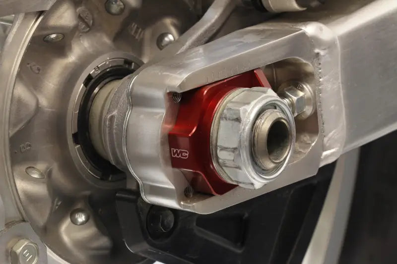 Motorcycle swingarm axle adjuster with Axle Blocks Elite Hon Red for precise tuning