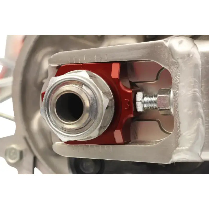 Motorcycle swingarm axle adjuster with 17-205 Axle Blocks Elite Hon Red for easy tuning