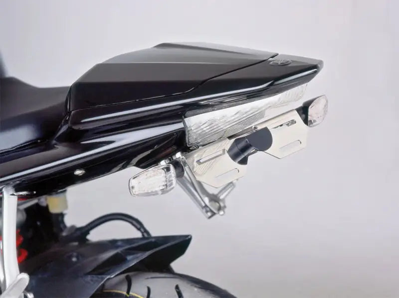 Rear view of a black motorcycle with tail light and turn signals using 1779N Fender Eliminator Kit Black