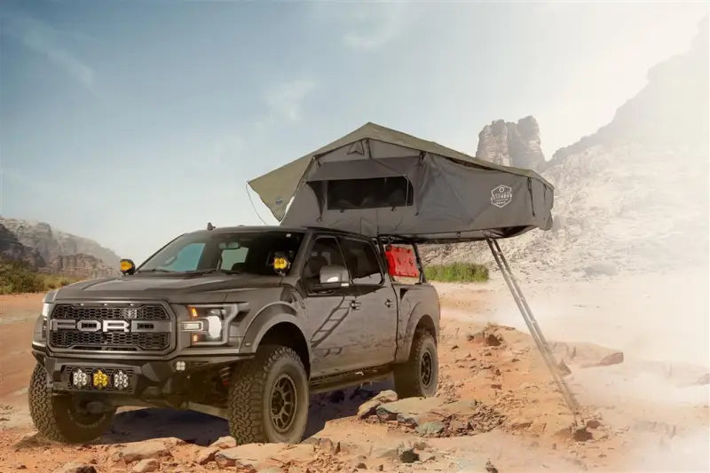 Ford Raptor truck with Overland Vcl Nomadic 3 extended rooftop tent