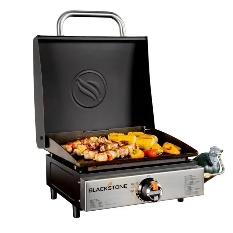 Blackstone griddle w hood showing food on cooking area for delicious meals