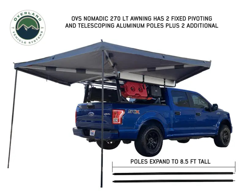 Blue pickup truck with 18379909 Overland Vcl Nomadic 270 Lt Passenger Awning attached