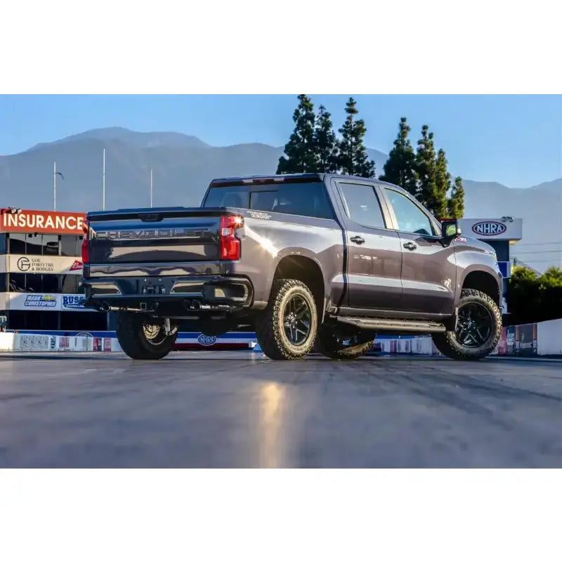 Dark gray Chevrolet Silverado with Vance & Hines cat-back exhaust polished tips
