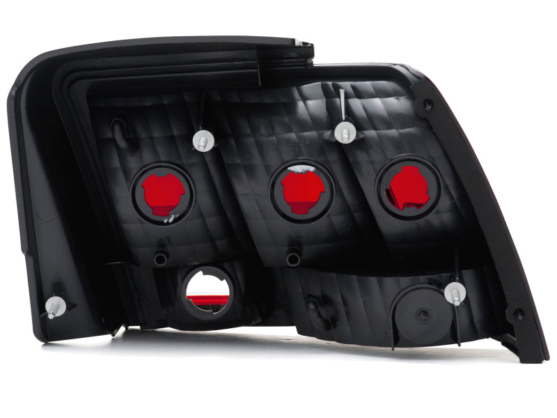 Raxiom 49080 Raxiom 99-04 Ford Mustang Excluding 99-01 Cobra Tail Lights- Black Housing (Smoked Lens)