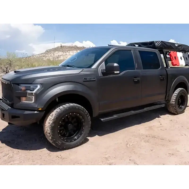 Black off-road truck with Nerf Bars, featuring the 2003-0366BT Raptor 5' Slide Track Ovals Kit for enhanced performance and durability, AVADA - Best Sellers, Must Haves.