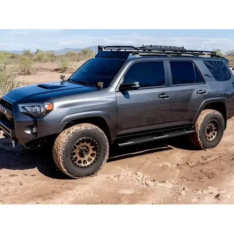 Off-road SUV equipped with 2004-0378BT Raptor 5' Slide Track Ovals Kit, designed for RV, automotive, powersports, and marine uses, ideal for exterior and interior applications, truck bed, rv parts, truck accessories, Nerf Bars & Running Boards, AVADA - Best Sellers, Must Haves.