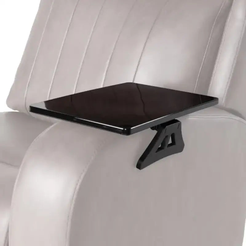 2020129999 Lippert Comp Arm Clamp Tray installed on armrest of a light gray chair.