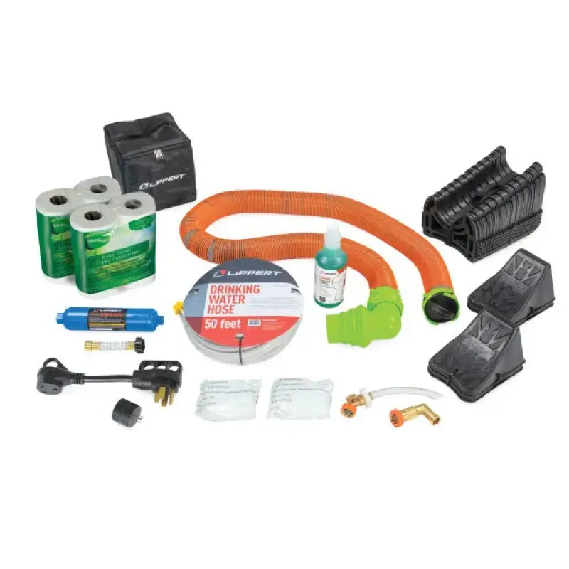 Lippert RV Starter Kit - Premium with high-quality essentials for RV setup and maintenance, including water hose, toilet tissue, and leveling blocks.