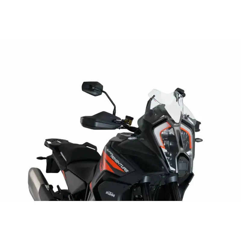 Black and orange adventure motorcycle with sport windscreen and prominent headlight